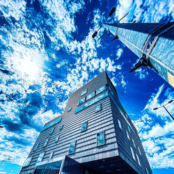 Low angle view of buildings against blue sky