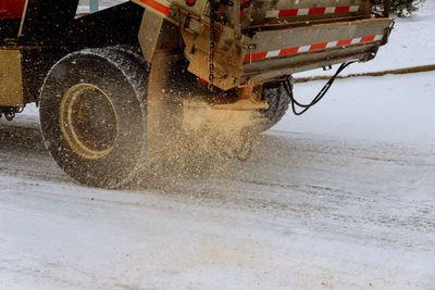 Side view of a man on wet road