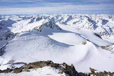 Scenic view of snowcapped mountains against sky