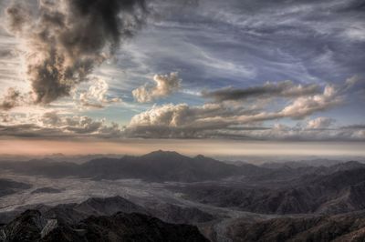 Scenic view of dramatic sky over landscape