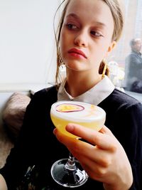 Portrait of woman holding drink