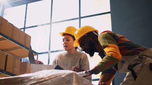 Rear view of man working at construction site