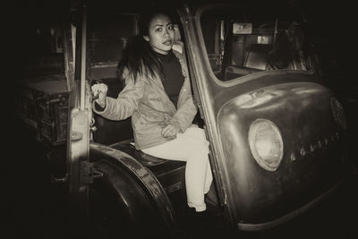 Portrait of woman sitting in car