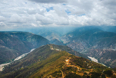 Aerial view of mountains against sky