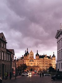 View of buildings against cloudy sky