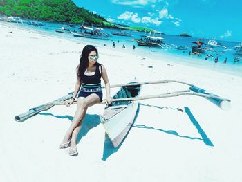 Full length of young woman on beach