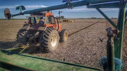 Man working on field against sky
