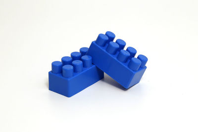 Close-up of blue toy against white background