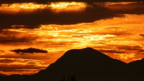 Low angle view of dramatic sky during sunset