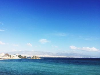 Scenic view of sea against blue sky