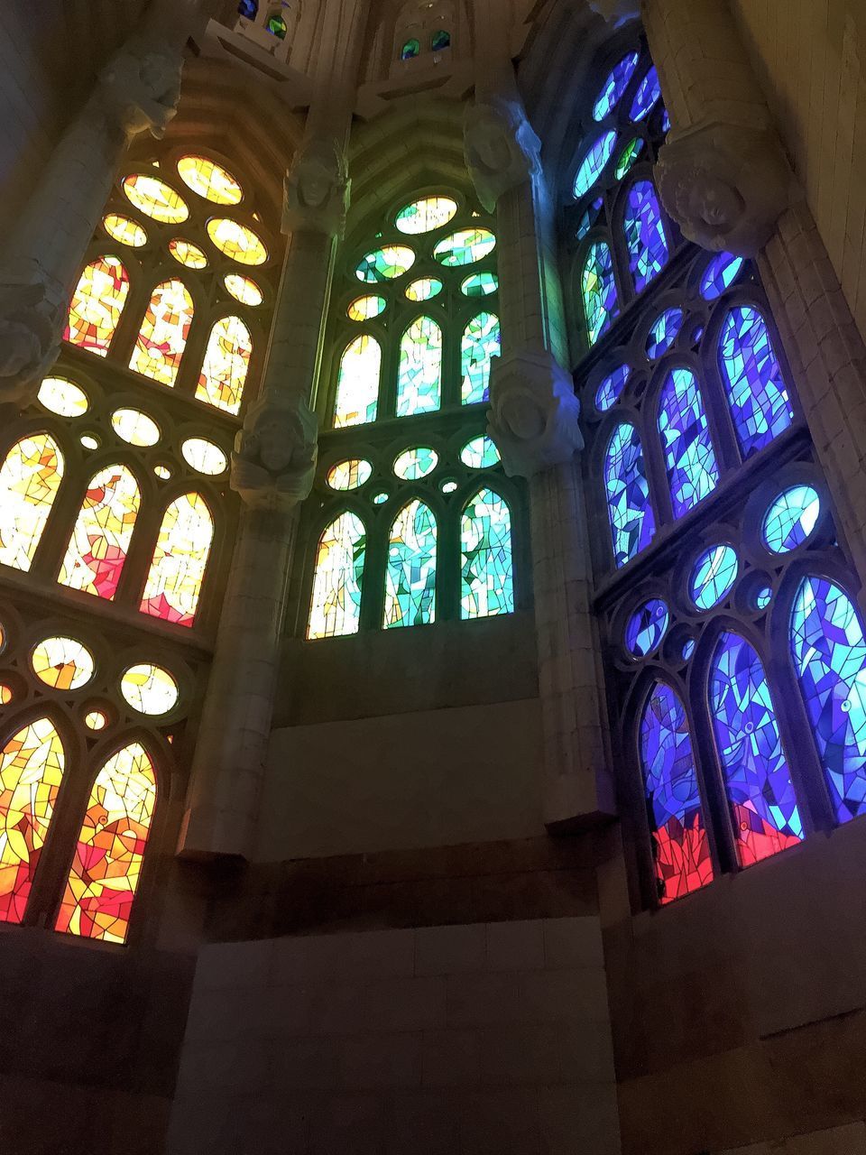 LOW ANGLE VIEW OF STAINED GLASS WINDOW OF BUILDING