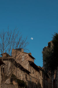 Low angle view of buildings against blue sky