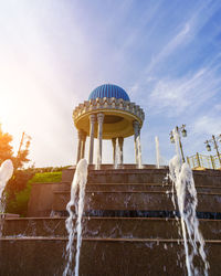 Low angle view of fountain against sky