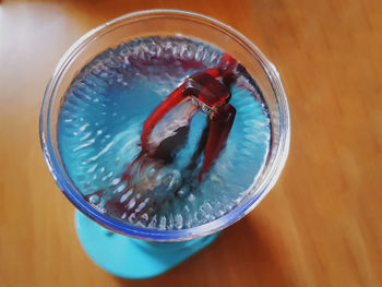 High angle view of drink in glass on table