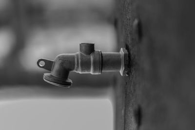 Close-up of faucet against wall