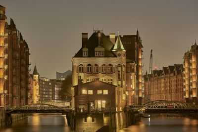 Illuminated buildings in city at night
