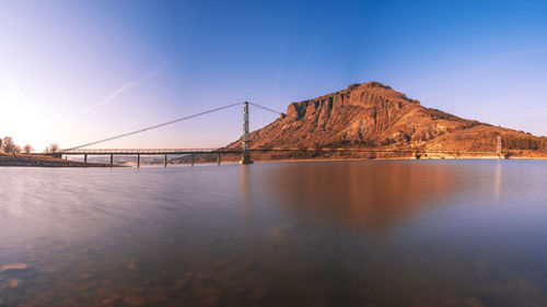 Bridge over sea against sky