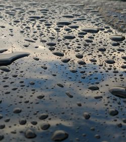 High angle view of wet sand during winter