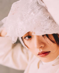 Close-up of young woman wearing veil