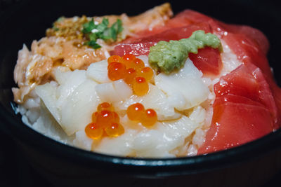 Close-up of fish with rice served in bowl