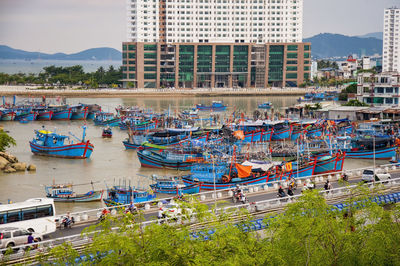 High angle view of boats moored in city