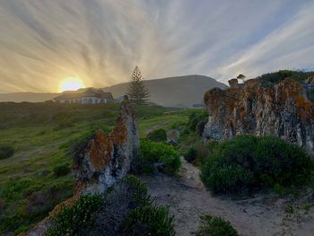 Scenic view of landscape against sky during sunset