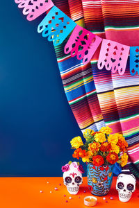 High angle view of multi colored toy on table against blue background