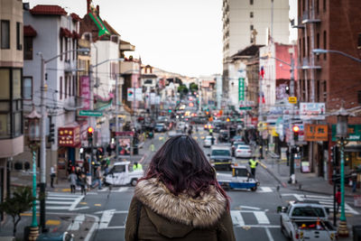 Rear view of woman in city