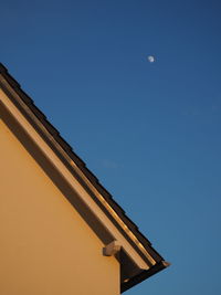 Low angle view of built structure against clear blue sky