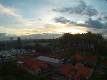High angle view of town against sky during sunset