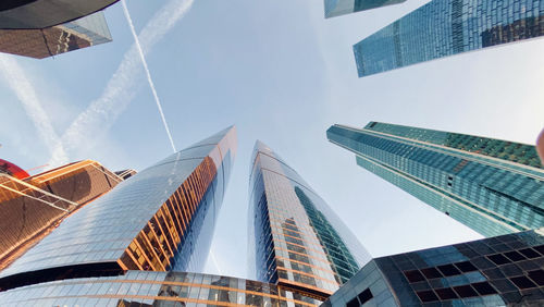 Low angle view of modern buildings against sky