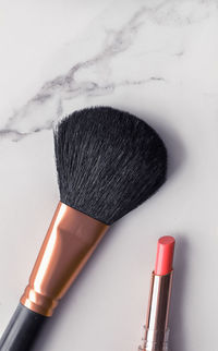 Close-up of make-up brushes on white background