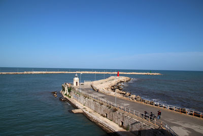 Trani,  italy, 4 december 2022, the lighthouse, the piers seen from the belvedere of the fort