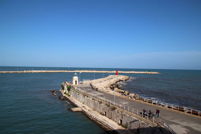 Scenic view of sea against clear blue sky