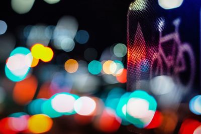 Defocused image of illuminated city at night