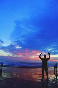 Scenic view of sea at sunset