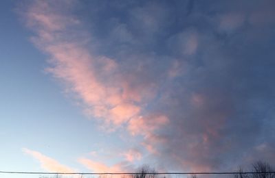 Low angle view of cloudy sky during sunset