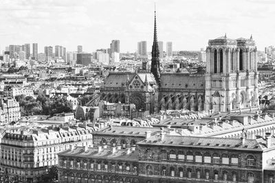 Buildings in city against sky