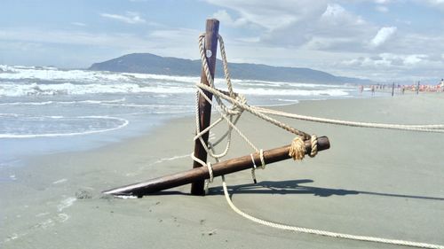 Nautical vessel moored on sea against sky