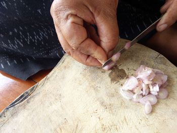 High angle view of man preparing food on table