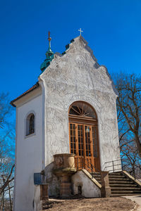 Low angle view of building against blue sky