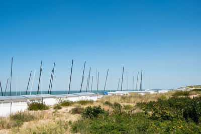 Scenic view of sea against clear blue sky