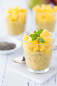 Healthy mango chia pudding parfaits topped with diced mango.