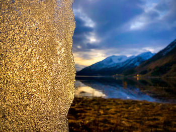 Scenic view of lake against sky during winter