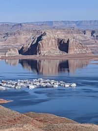 Scenic view of lake against blue sky