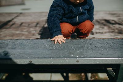 Boy playing in water outdoors