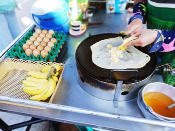 High angle view of person preparing food