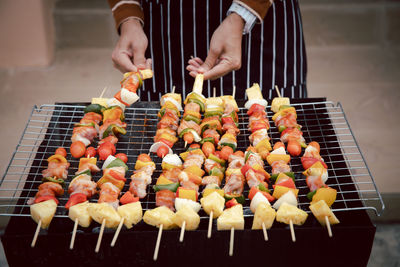 Man preparing food on barbecue grill