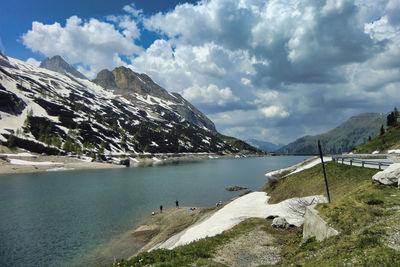 Scenic view of lake and mountains against sky