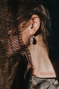 Close-up of woman by window